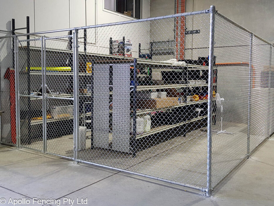 Custom-built chain wire storage enclosure installed around warehouse shelving in Southport on the Gold Coast, designed for visibility and asset protection. Installed by Apollo Fencing