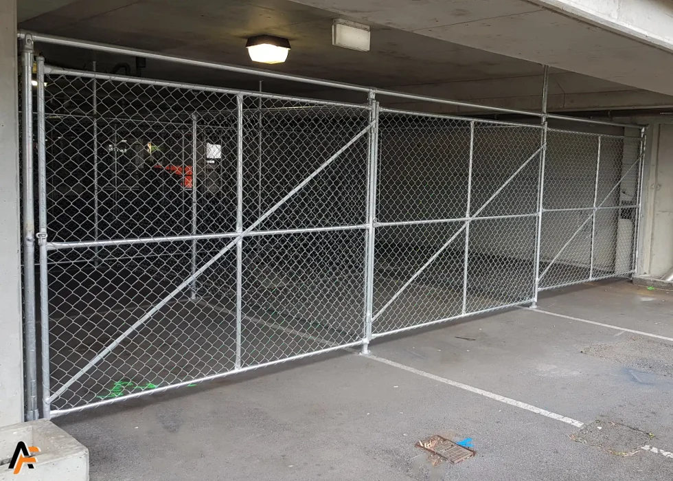 commercial bi fold gates with galvanised finish installed in brisbane by apollo fencing