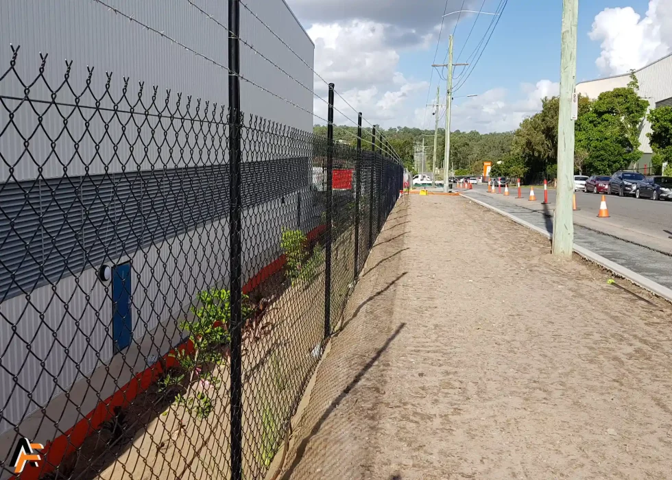 Commercial fencing with chain wire along the side of an industrial property in Brisbane.