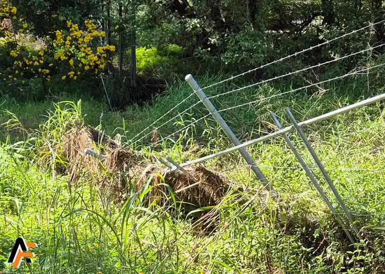 damaged chain wire fencing in brisbane by floods before repair
