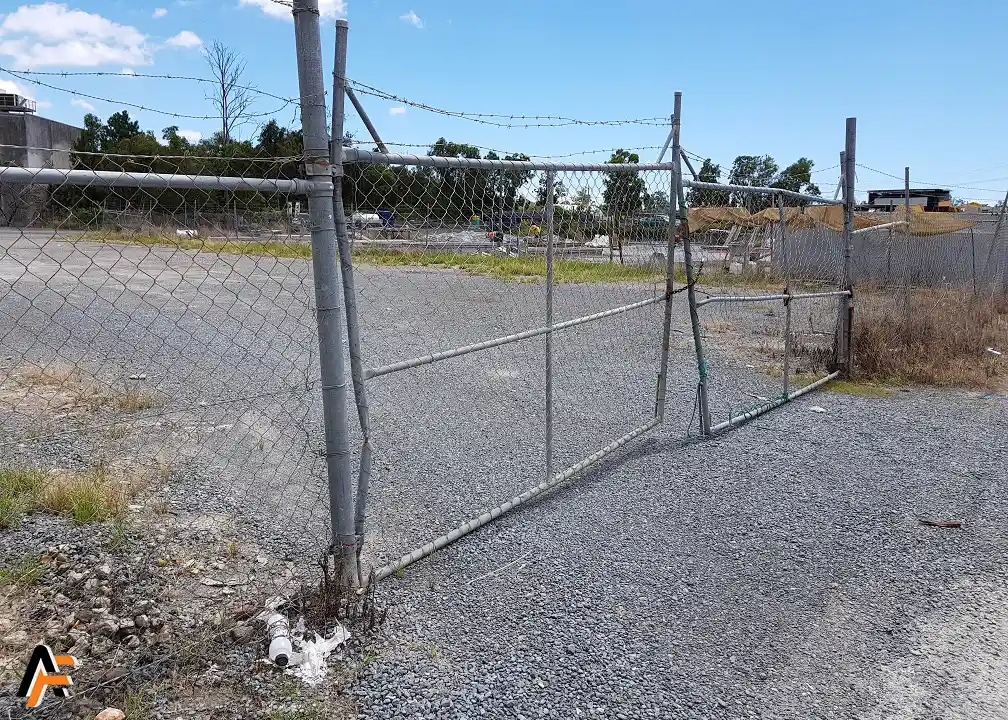 damaged chain wire gate before repairs