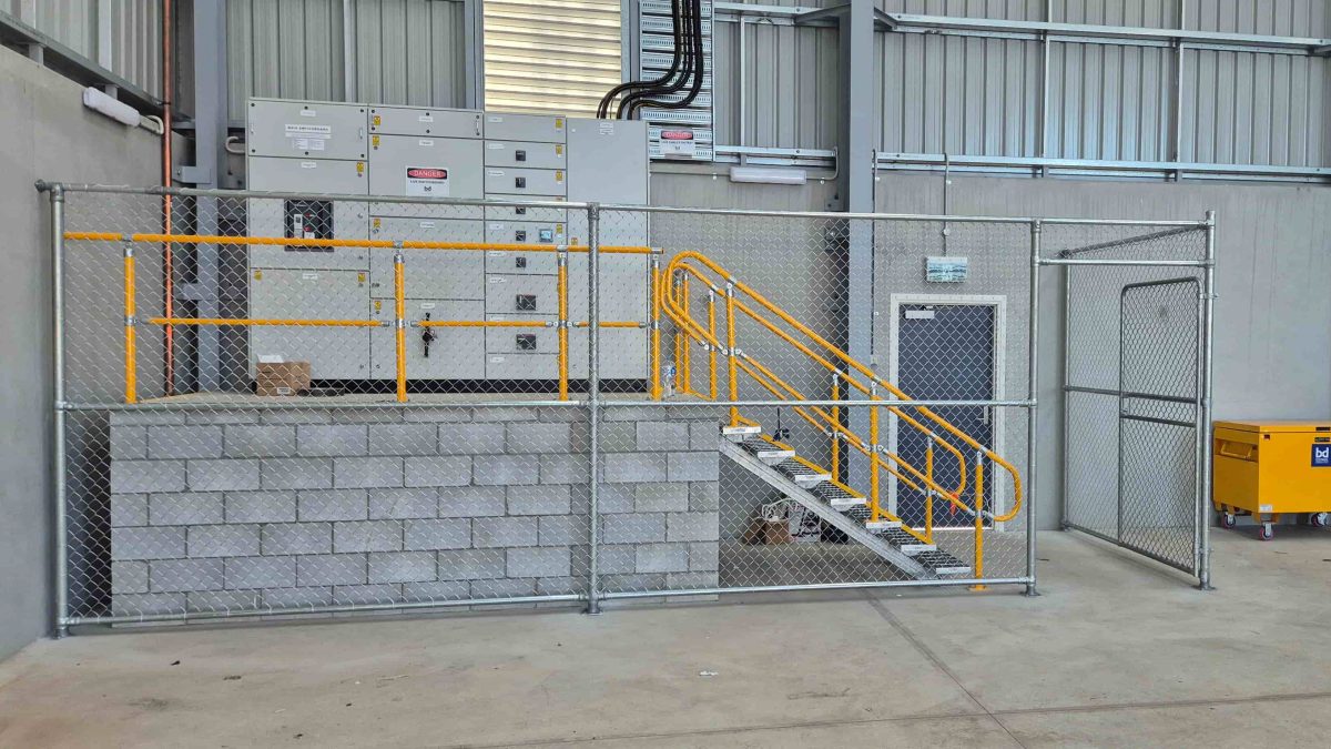 Galvanised chain wire fencing around electrical switchboard forming a security cage installed in rocklea by apollo fencing